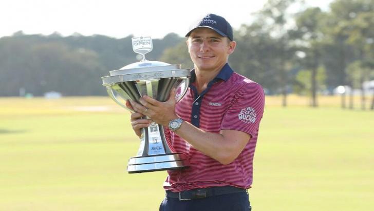 Carlos Ortiz with the Houston Open trophy in 2020